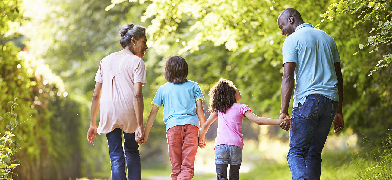 image of family walking holding hands